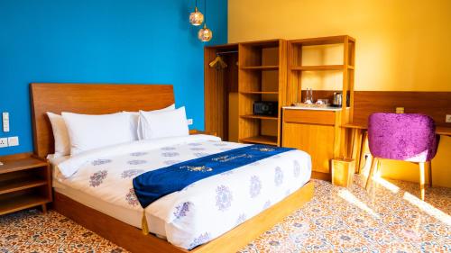 Postel nebo postele na pokoji v ubytování Rudra Sahashrara Bali - Ayurvedic - Health and Wellness Resort