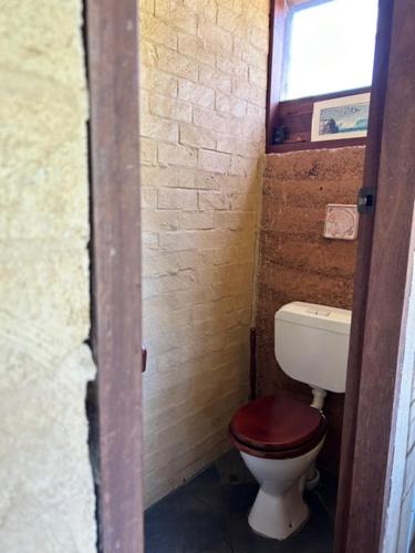 a small bathroom with a toilet and a window at Tea Tree - Pet Friendly - Prevelly - Margaret River in Margaret River Town