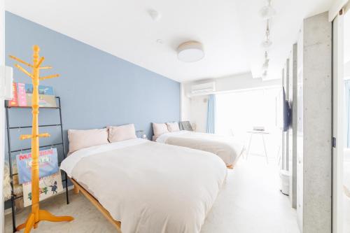 Postel nebo postele na pokoji v ubytování Aquamarine