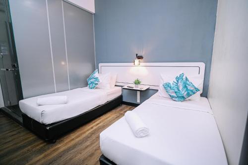 Katil atau katil-katil dalam bilik di Swing & Pillows - Kota Kemuning Selangor