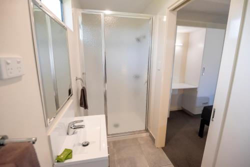 a bathroom with a shower and a sink at Margaret River Tourist Park in Margaret River Town