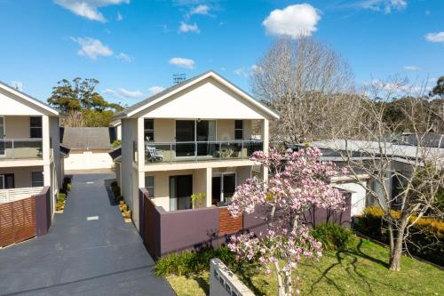 an aerial view of a house with a tree at Husky Haven by Experience Jervis Bay in Huskisson