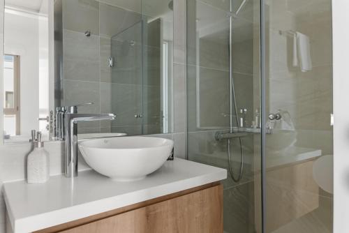 a bathroom with a bowl sink and a shower at Serenity Waves Villa 4 in Sophtadhes