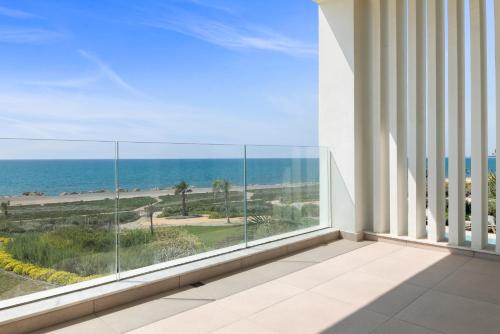 a balcony with a view of the ocean at Serenity Waves Villa 4 in Sophtadhes