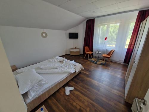 Postel nebo postele na pokoji v ubytování Casa Muntelui Râșnov
