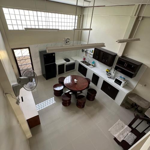 an overhead view of a kitchen with a table in it at Hatyai house 28 in Hat Yai