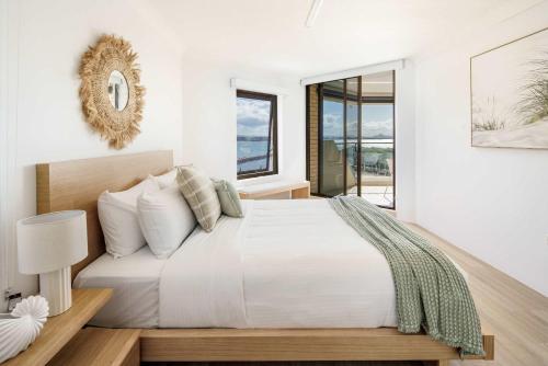 Ένα ή περισσότερα κρεβάτια σε δωμάτιο στο Beachfront Beauty in Buddina