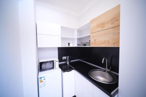 a bathroom with a sink and a counter at Sweet Home Apart-Hotel in Yerevan