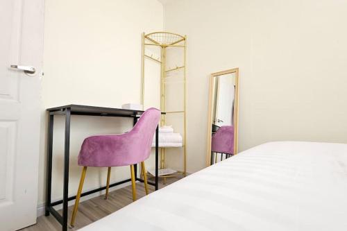 a bedroom with a bed and two mirrors at ChiShi House Songkhla in Ban Bang Dan