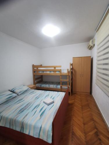 a bedroom with two bunk beds in a room at Bar-Apartman 2 in Bar