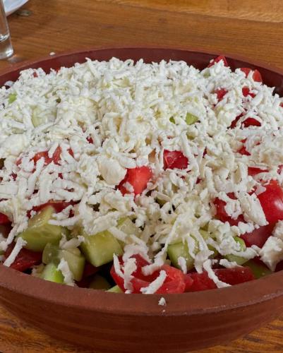 a bowl of food with rice and vegetables on a table at Villa Old House BN in Bitola