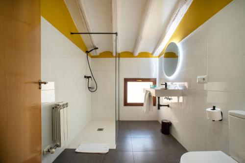 a bathroom with a shower and a toilet at Hotel-Boutique by Gonzalo Sesma in Cervera del Río Alhama