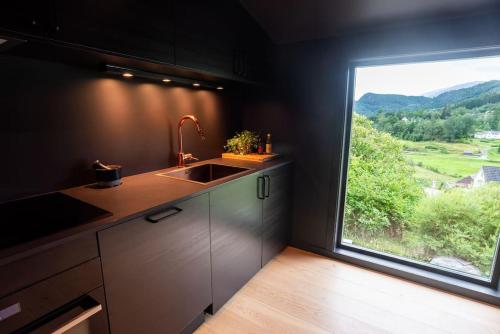 Η κουζίνα ή μικρή κουζίνα στο Lite hus 40 minutter unna Bergen