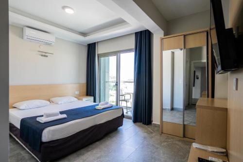 Postel nebo postele na pokoji v ubytování M2 Hotel