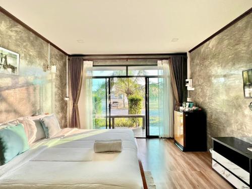 Postel nebo postele na pokoji v ubytování Baankao Resort Rayong