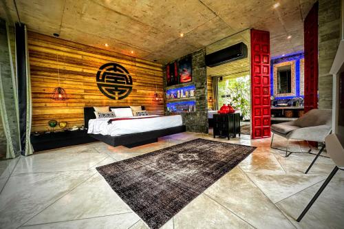 a bedroom with a bed and a wooden wall at Z VILLA InstaDream Luxury 180 Sea & Sunset in Ban Taling Ngam