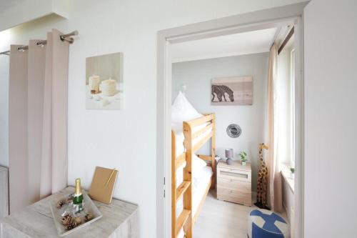 a small apartment with a staircase and a bedroom at NEU! Fernblick Hohegeiß Sauna Hallenbad in Hohegeiß