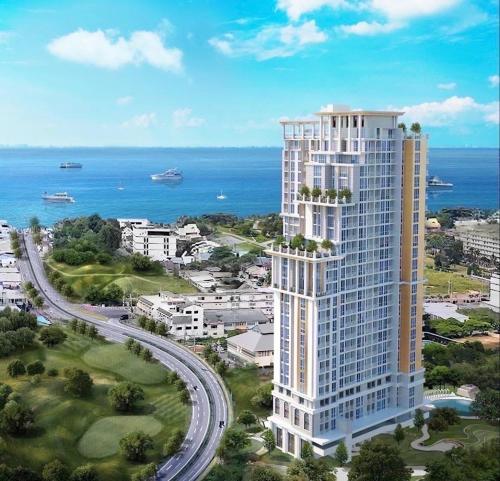 an aerial view of a large building near the ocean at Empire Tower Pattaya Jomtien Beach in Jomtien Beach