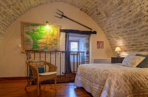 Postel nebo postele na pokoji v ubytování Gîte Gîte La Bastide 2/4 personnes à Sauveterre
