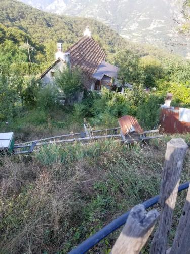 a house on a hill with a train yard at Bujtina Kashnjeti te Lush Zefi in Lekbibaj