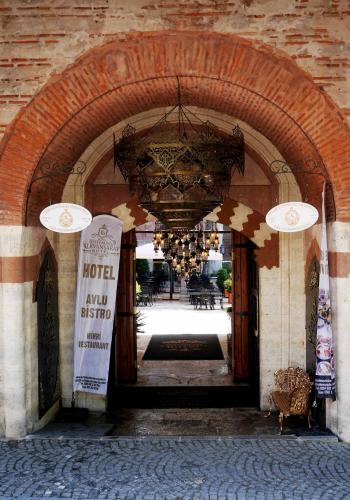 an entrance to a building with a chandelier at Rüstempaşa Kervansaray Hotel in Edirne