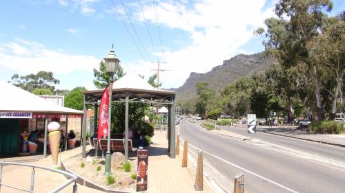 a bus stop on the side of a road at Gariwerd Motel in Halls Gap
