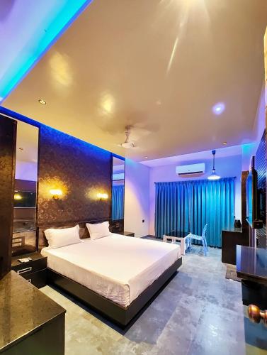 a bedroom with a large white bed in a room at M S RESIDENCY in Chennai