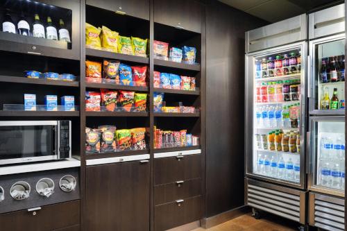 a refrigerator filled with lots of food and drinks at Courtyard by Marriott Little Rock West in Little Rock