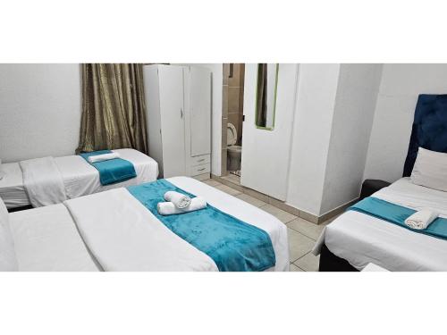 Ένα ή περισσότερα κρεβάτια σε δωμάτιο στο Goshen Lodge Fitzroy