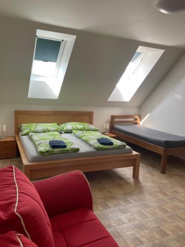 Postel nebo postele na pokoji v ubytování Apartmány s klimatizací - Penzion U Kudláčků Pouzdřany