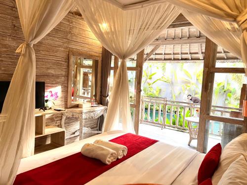A bed or beds in a room at Sri Permana Suite and Villa Ubud