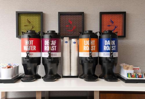 a group of cans on a shelf in a room at Hampton Inn San Diego/Del Mar in San Diego