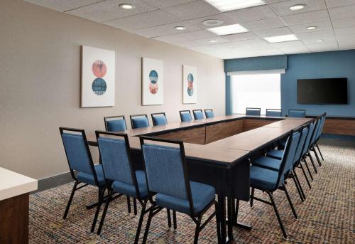 a conference room with a long table and chairs at Hampton Inn San Diego/Del Mar in San Diego