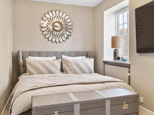 a bedroom with a bed with a large mirror on the wall at Sanders Swan - Marvellous villa close to the center of Copenhagen in Copenhagen