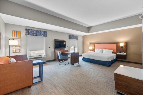 a hotel room with a bed and a desk at Hampton Inn & Suites - Saint Louis South Interstate 55 in Saint Louis