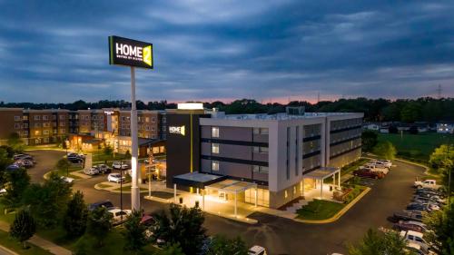 an aerial view of a hotel with a building at Home2 Suites By Hilton Lafayette in Lafayette