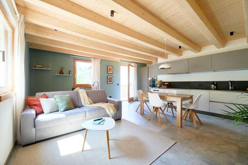 a living room with a couch and a table at Ai Masetti di TSS'- Riposo nel Verde, curato, silenzioso in Vignola