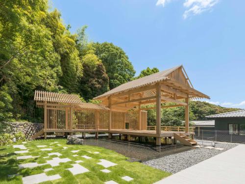 a wooden gazebo in a garden at Banyan Tree Higashiyama Kyoto in Kyoto