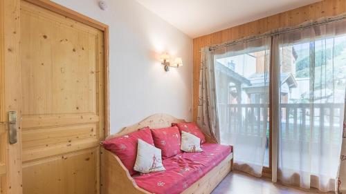 En eller flere senge i et værelse på A006- Appartement 2 pieces 4 personnes