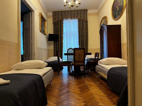 Posteľ alebo postele v izbe v ubytovaní Metropolitan Apartments