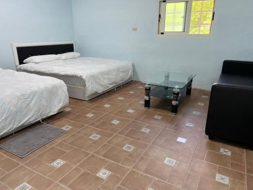 Ein Bett oder Betten in einem Zimmer der Unterkunft Gu Ren People Homestay
