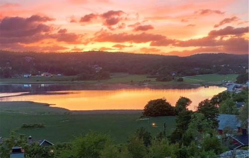 a view of a lake at sunset at Beautiful Home In Skjeberg With Kitchen in Skjeberg