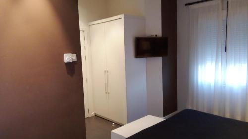 Телевизор и/или развлекательный центр в Hotel Villa Sonsierra