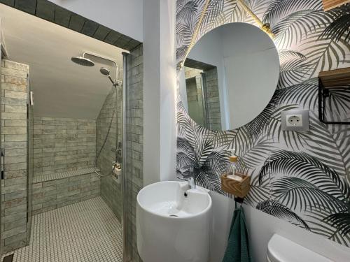 a bathroom with a sink and a mirror at La Palapa Beach in Benalmadena Costa