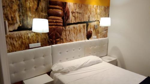 Кровать или кровати в номере Hotel Villa Sonsierra