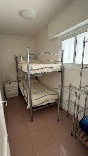 two bunk beds in a room with a window at Premium Luxury Residence RITS in Salou