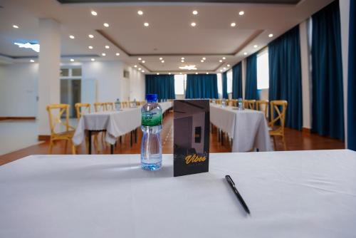 a bottle of water sitting on top of a table at Vibes Hotel and Spa in Addis Ababa