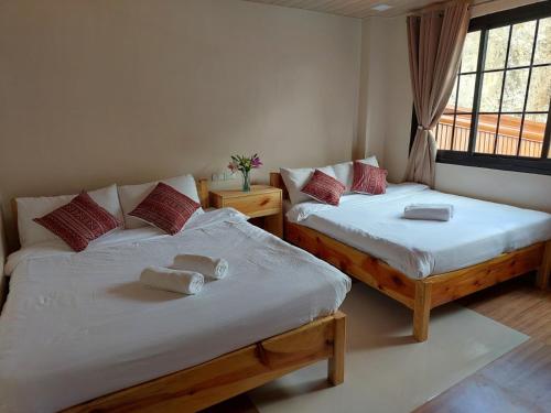 Postel nebo postele na pokoji v ubytování Quarry Bay Hometel Sagada