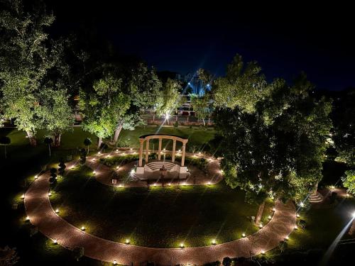 an overhead view of a park with a gazebo at night at Peshawar Barracks Hotel Estb-1867 in Peshawar