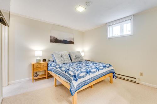 a bedroom with a bed and a desk and a window at Renovated Ski-InandSki-Out Peru Condo at Bromley Mtn in Peru
